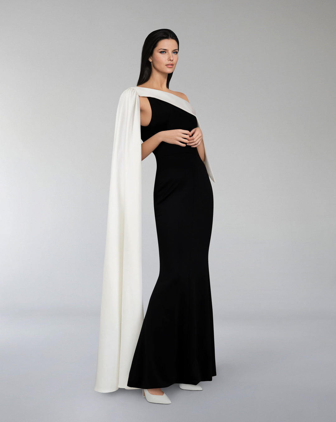 Bicolour column dress with asymmetrical neckline and side cape