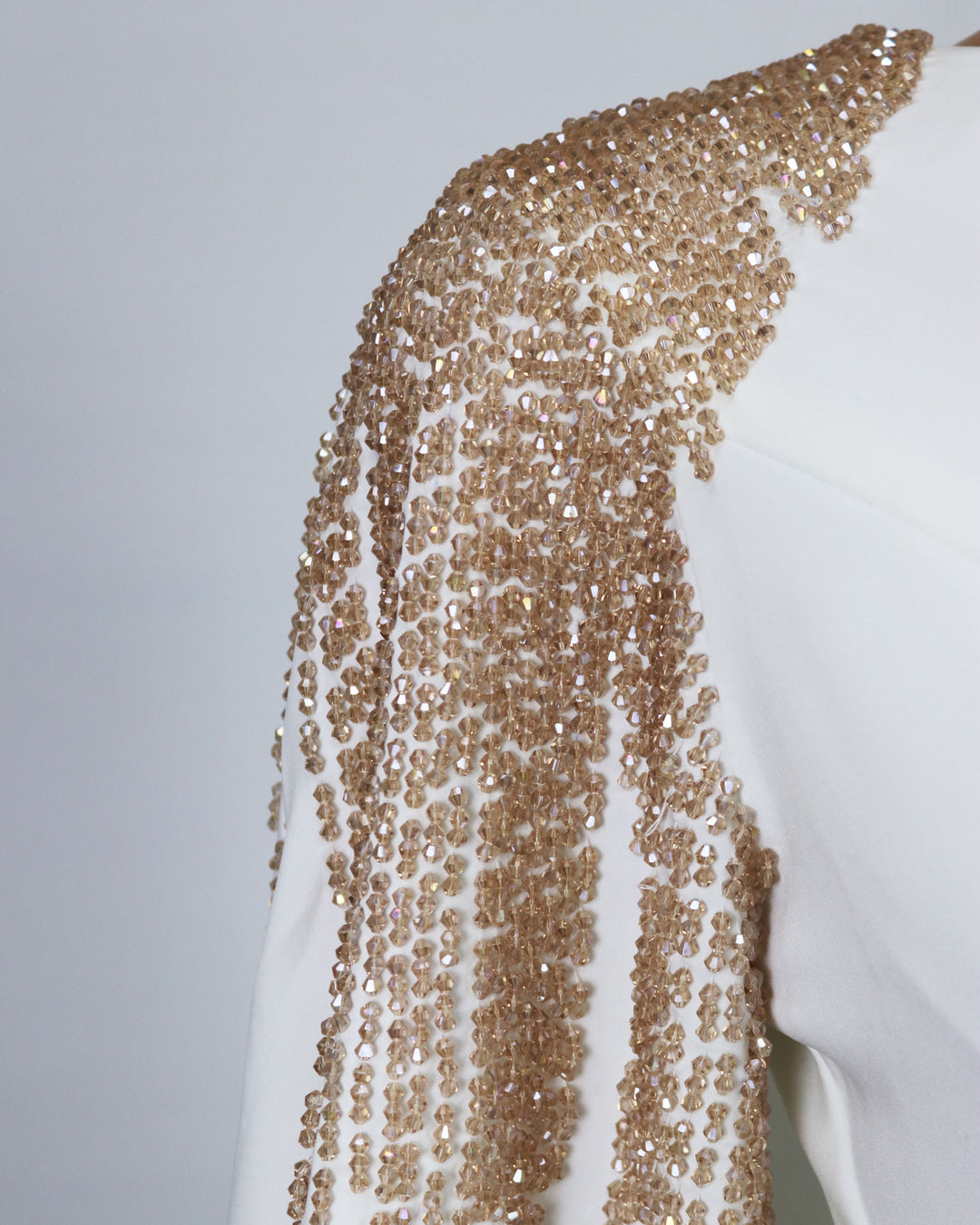Beaded shoulders and cuffs dress with back cape