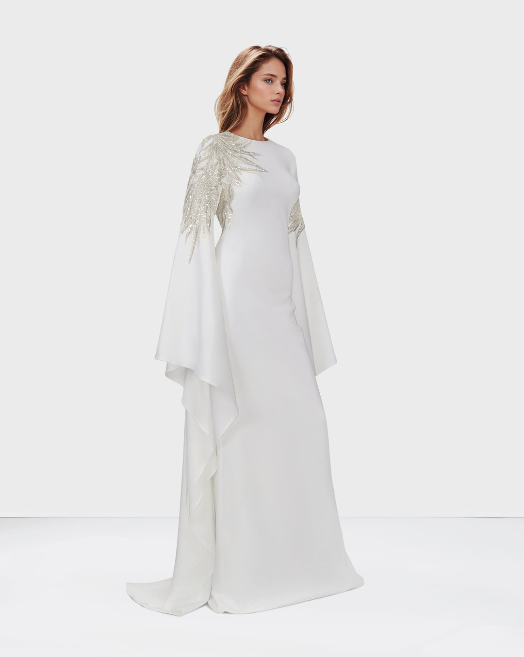 Sequined white dress with floor-length sleeves