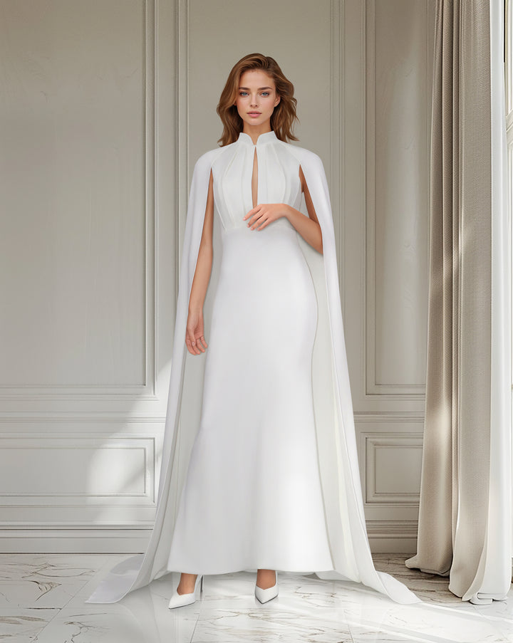 White pleated dress with neckline and cape