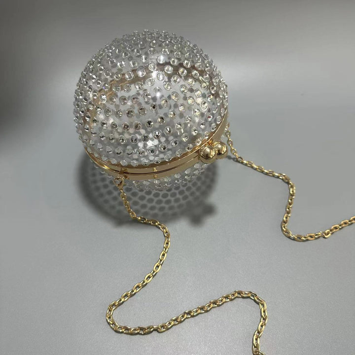 round crystal-embellished clutch with gold frame – NORVILA