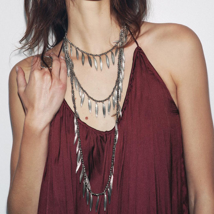 layered leaf pendant necklace with metallic finish – SERENAT