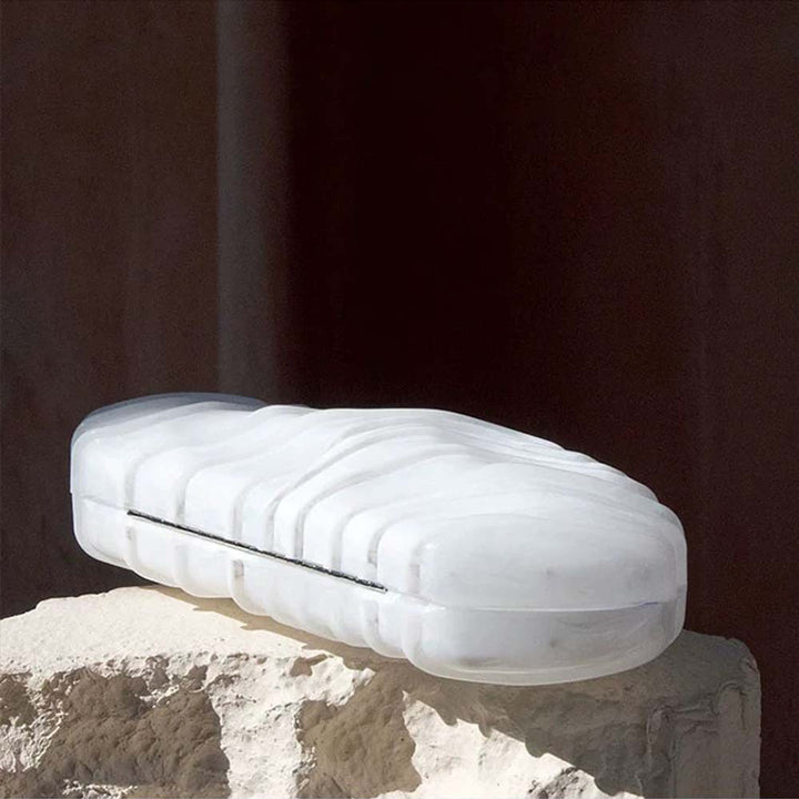 sculpted marble-effect clutch with wave texture – CORALVU