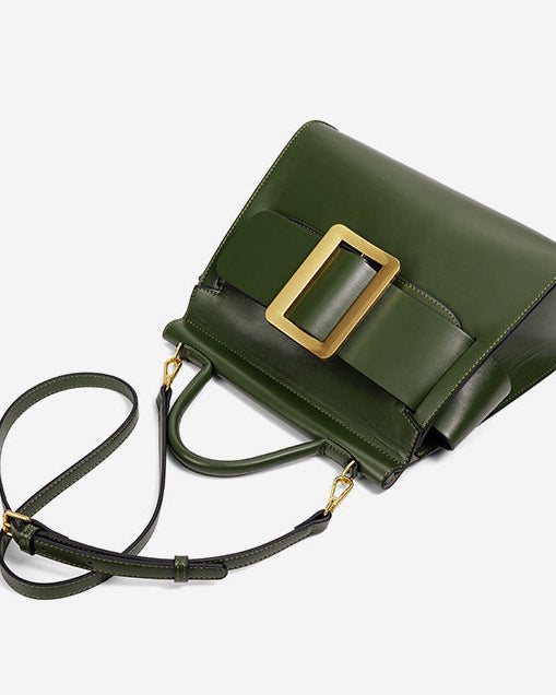 structured leather top-handle bag with oversized buckle – AURIKLA