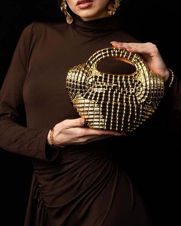 metallic sculpted handbag with curved handle – AURANIV