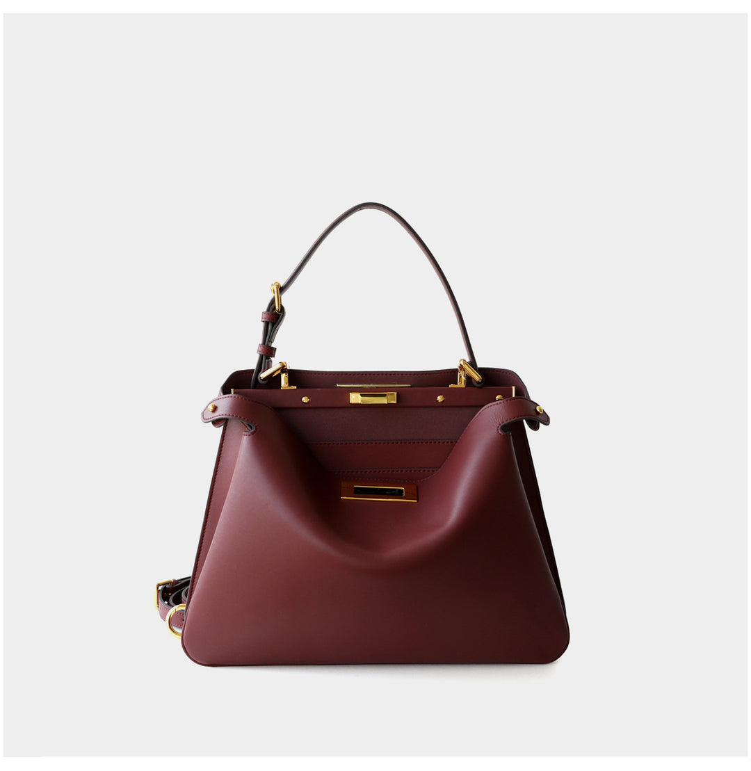 structured leather top-handle bag with gold hardware – ARIEL