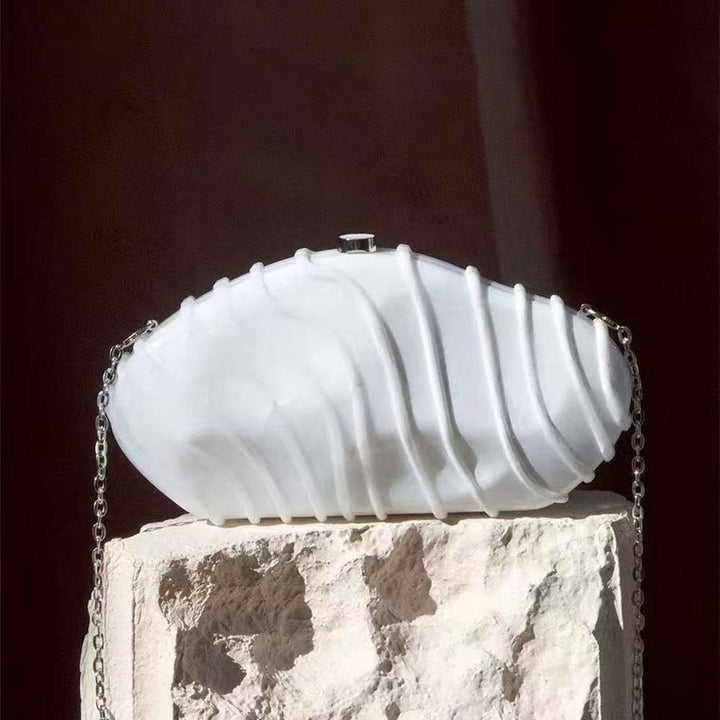 sculpted marble-effect clutch with wave texture – CORALVU