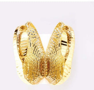 metallic sculpted handbag with curved handle – AURANIV