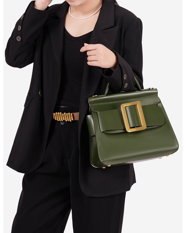 structured leather top-handle bag with oversized buckle – AURIKLA