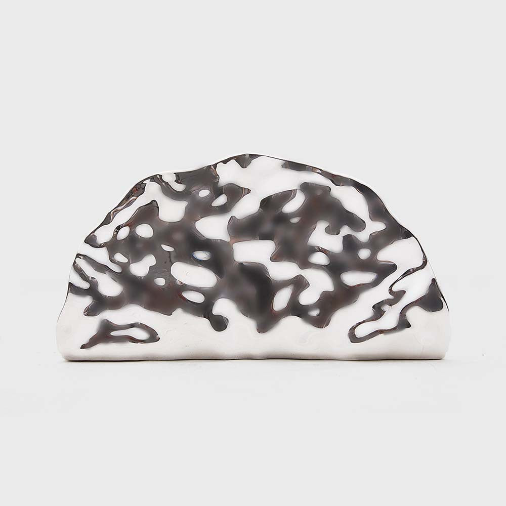 sculpted metallic clutch with abstract cutout design – NOIRÉP
