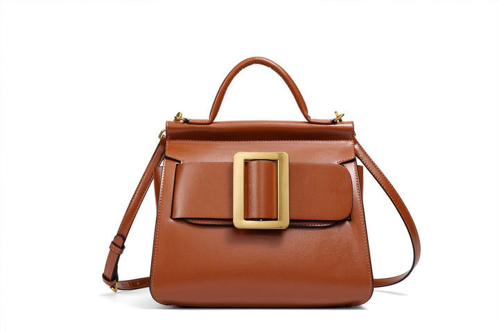 structured leather top-handle bag with oversized buckle – AURIKLA