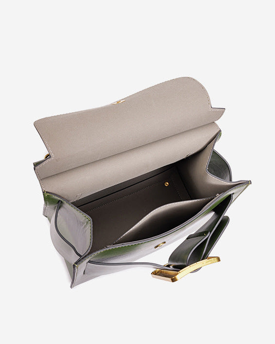 structured leather top-handle bag with oversized buckle – AURIKLA