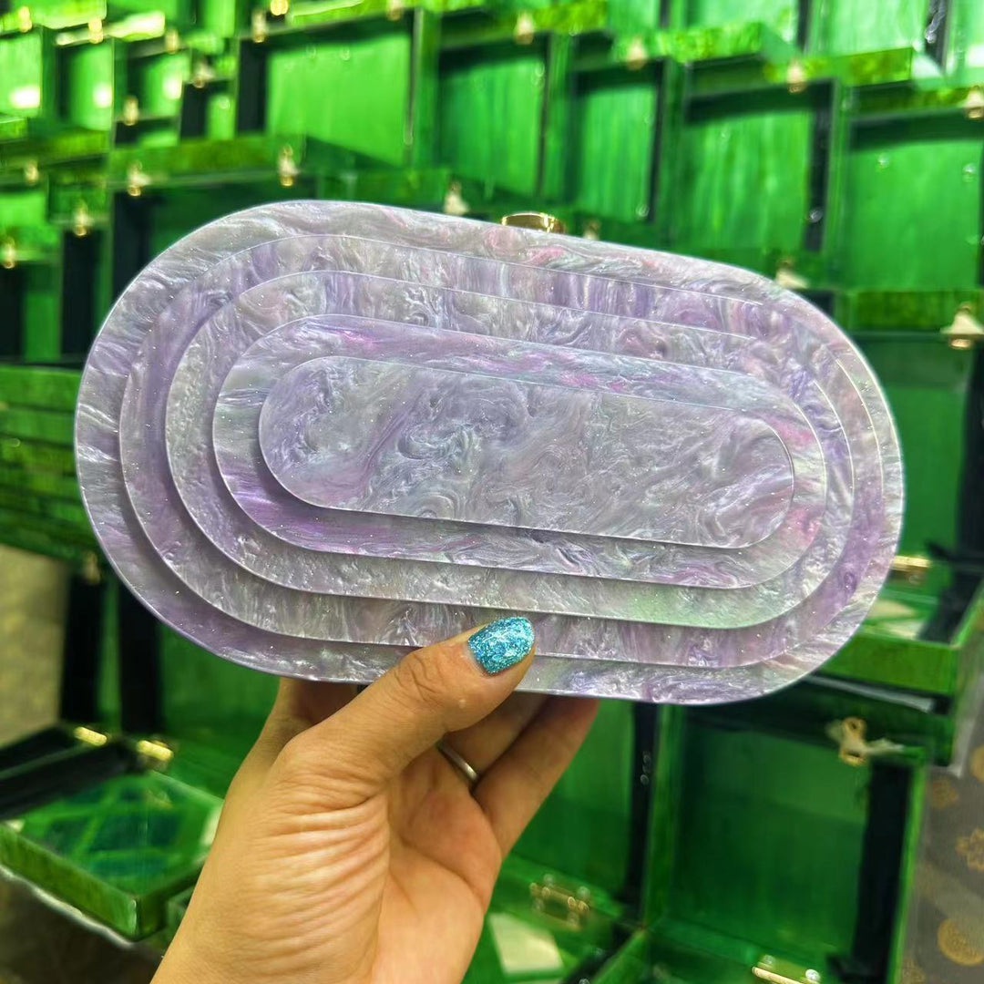layered oval resin clutch in jade green – EMERALDA