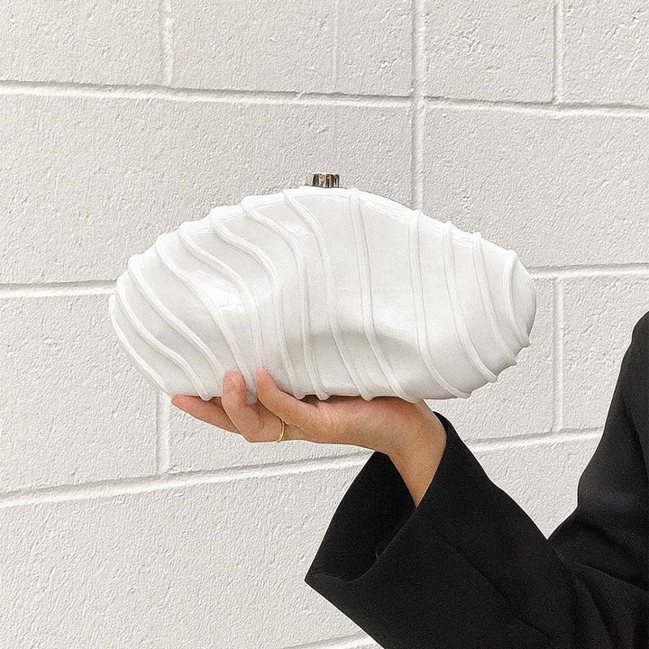 sculpted marble-effect clutch with wave texture – CORALVU