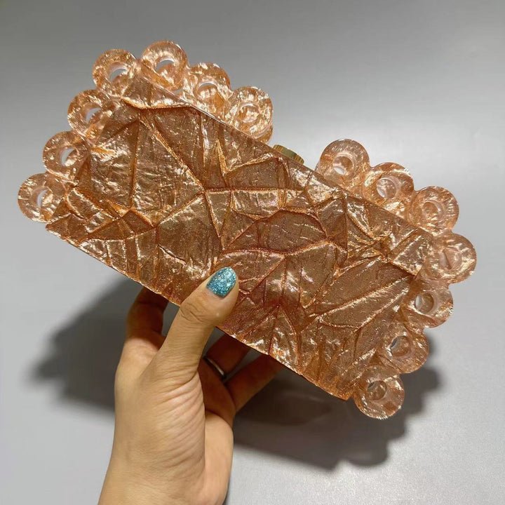 textured gold clutch with circular edge detailing – AURELIA