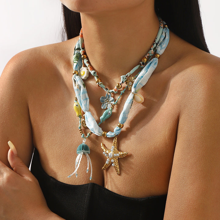 charm pendant necklace with silk and beaded accents – CORALIP