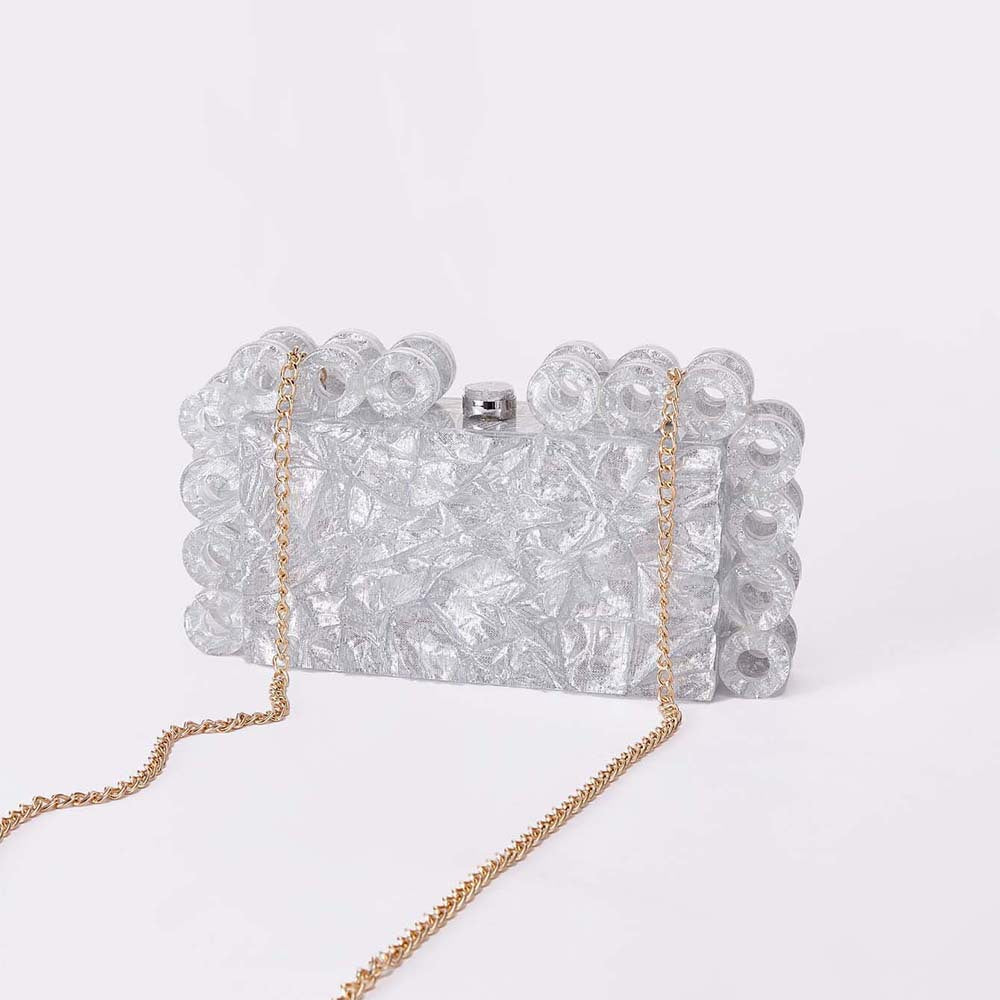 textured gold clutch with circular edge detailing – AURELIA