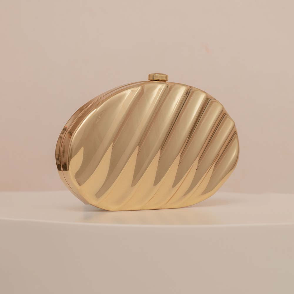 Textured metallic clutch with sculpted wave design – SHELL