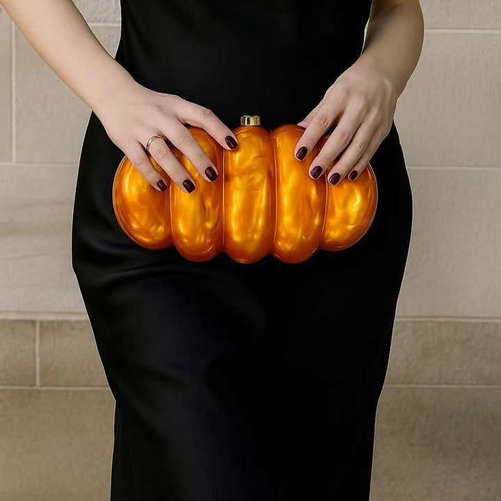 sculpted fuchsia resin clutch with glossy finish – RUBINA