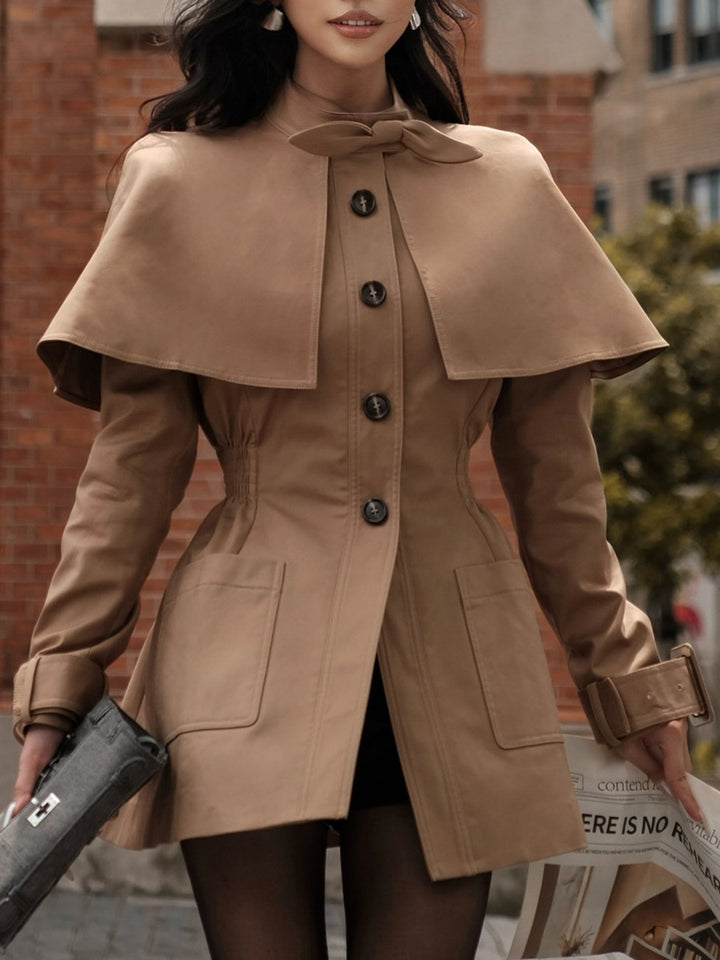tailored coat with cape overlay and bow neckline – AMBER