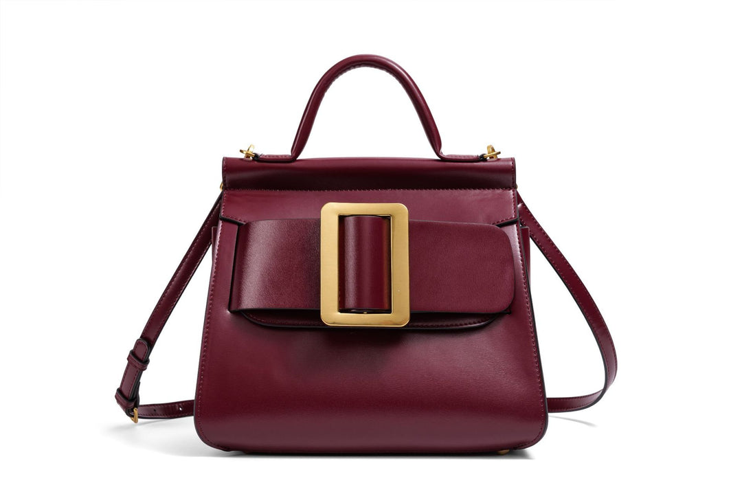 structured leather top-handle bag with oversized buckle – AURIKLA