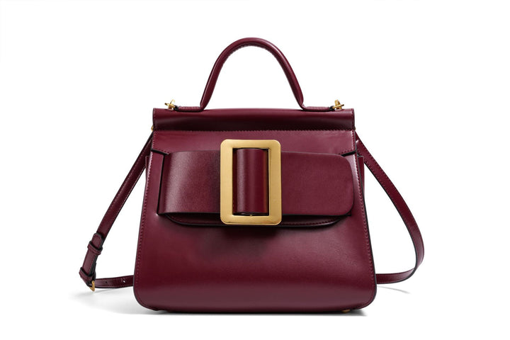 structured leather top-handle bag with oversized buckle – AURIKLA