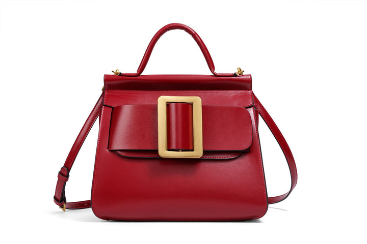 structured leather top-handle bag with oversized buckle – AURIKLA