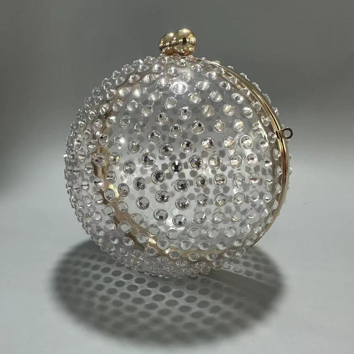 round crystal-embellished clutch with gold frame – NORVILA