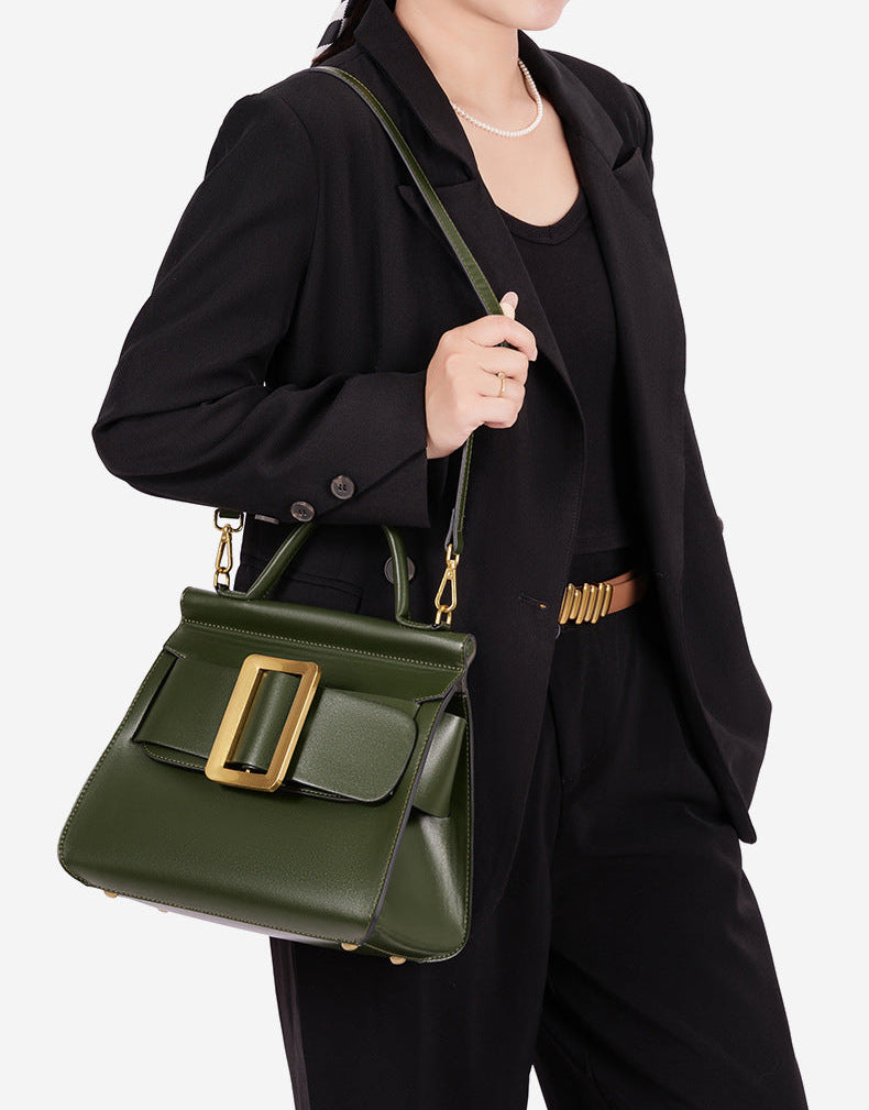 structured leather top-handle bag with oversized buckle – AURIKLA