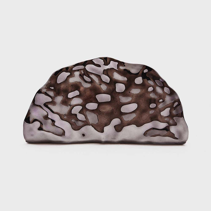sculpted metallic clutch with abstract cutout design – NOIRÉP