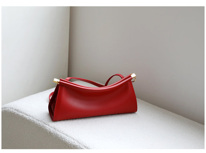 sleek leather shoulder bag with curved silhouette – ZOKSH