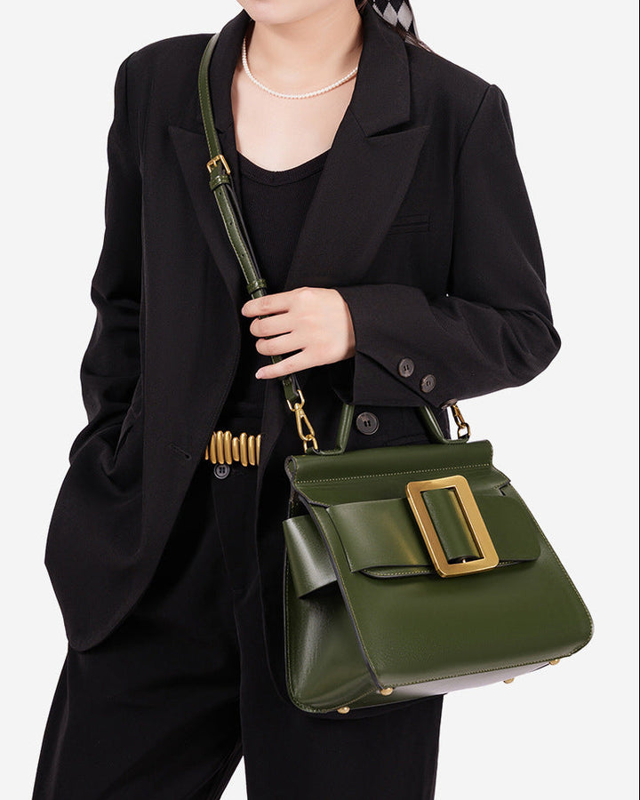 structured leather top-handle bag with oversized buckle – AURIKLA