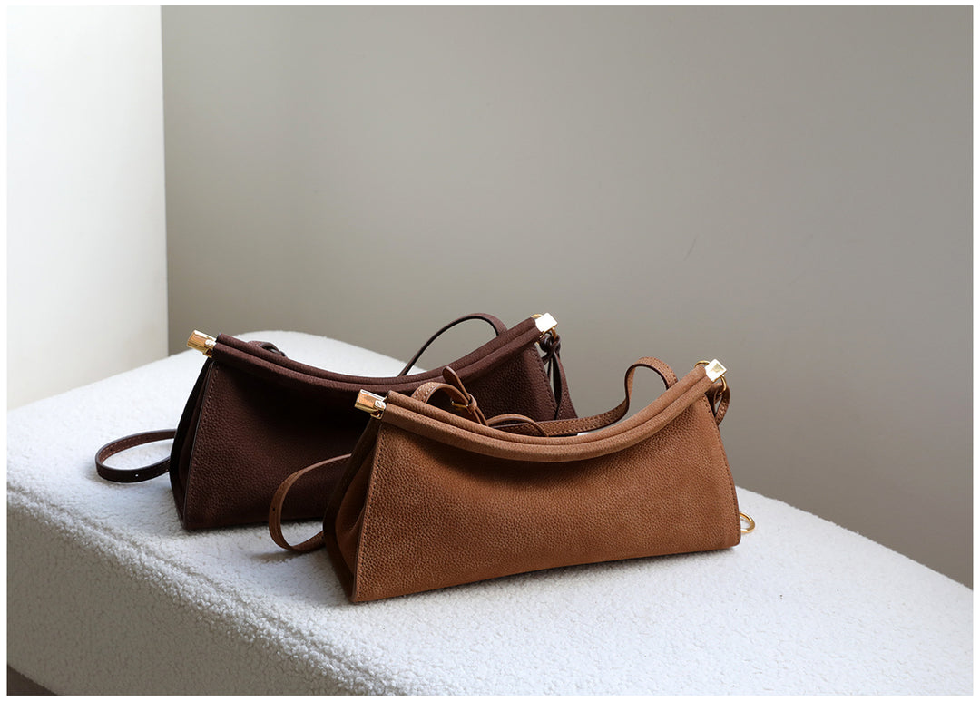 sleek leather shoulder bag with curved silhouette – ZOKSH