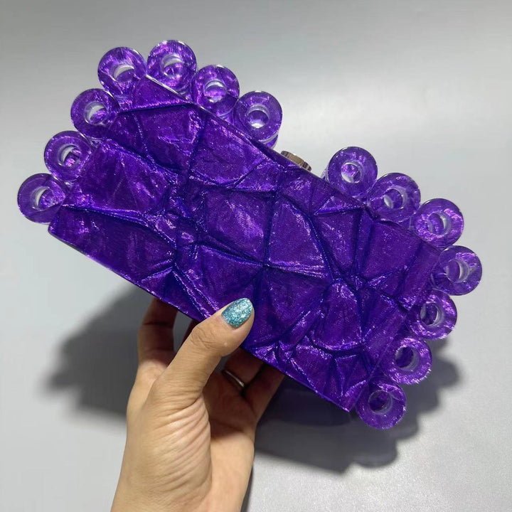 textured gold clutch with circular edge detailing – AURELIA