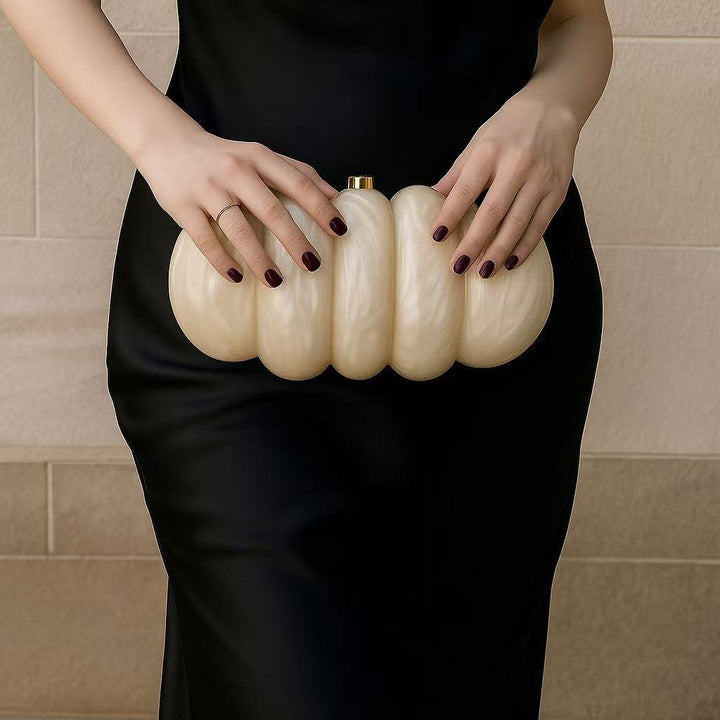 sculpted fuchsia resin clutch with glossy finish – RUBINA