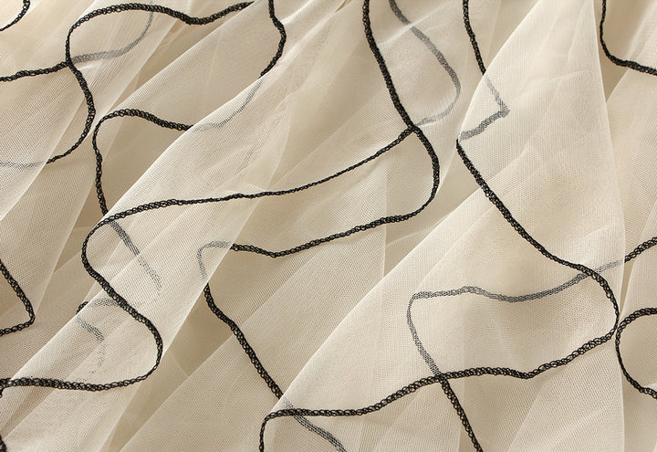 layered tulle skirt with contrast wave edging – SERENE