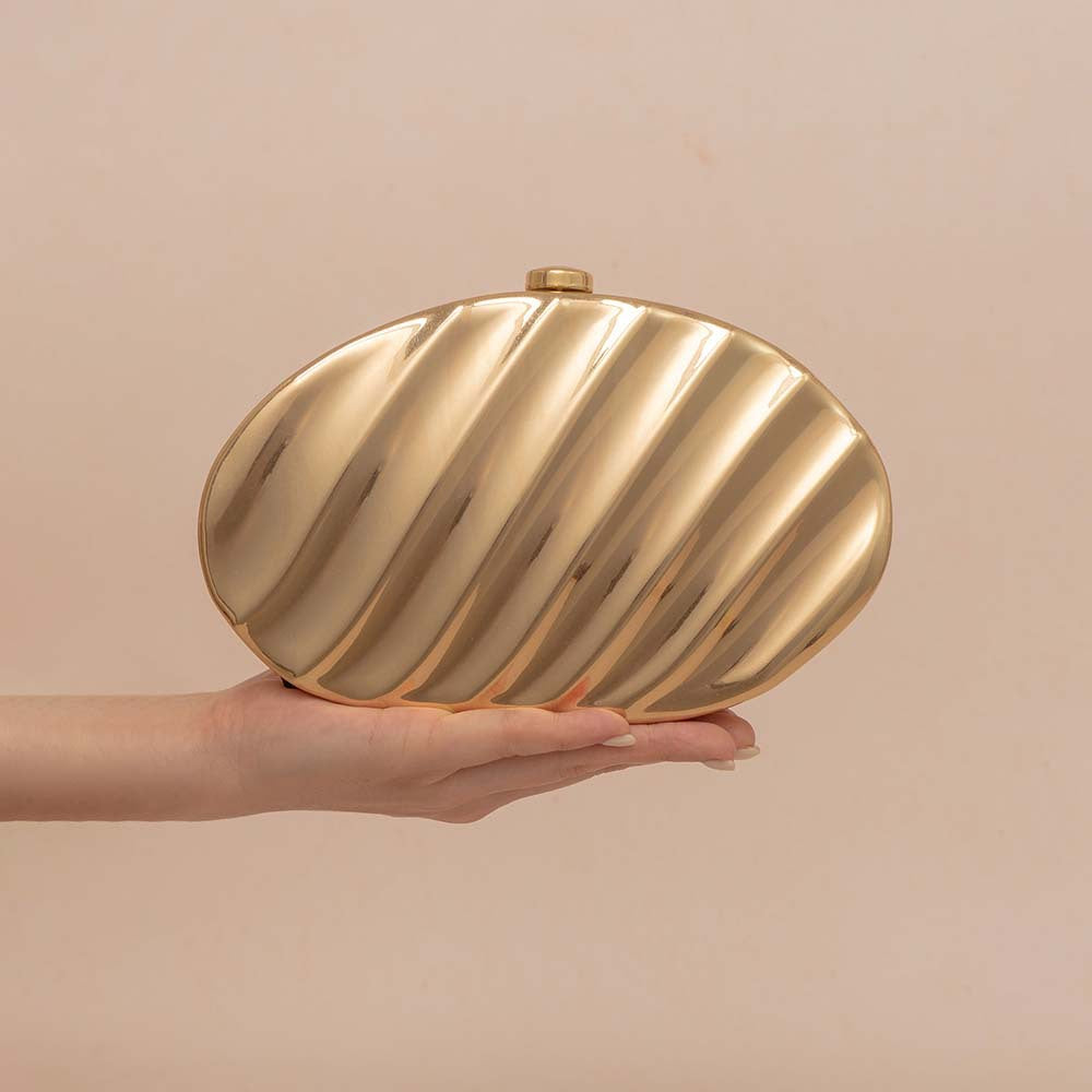 Textured metallic clutch with sculpted wave design – SHELL