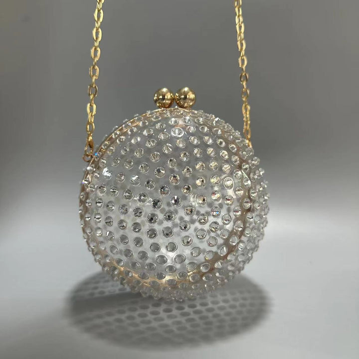 round crystal-embellished clutch with gold frame – NORVILA