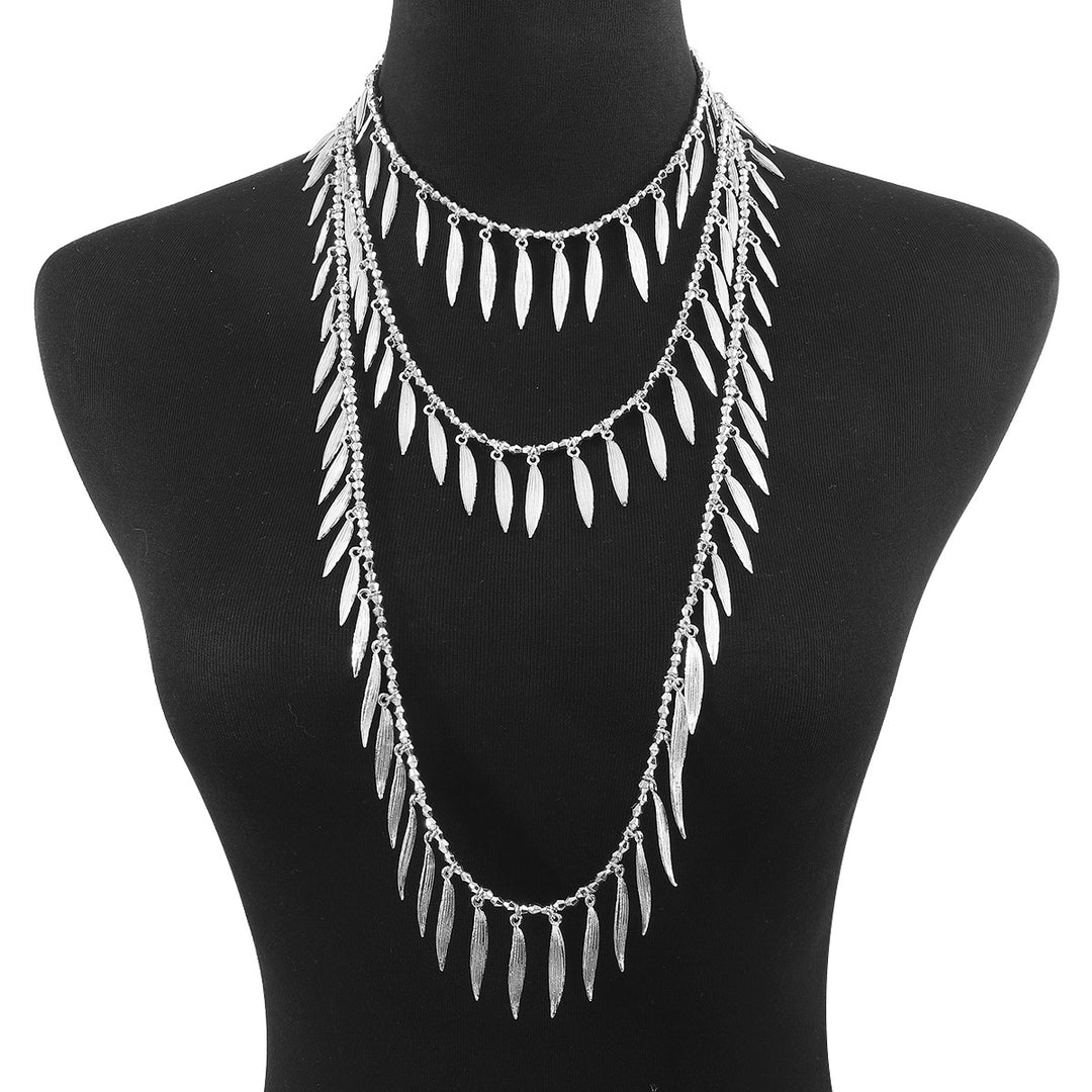 layered leaf pendant necklace with metallic finish – SERENAT