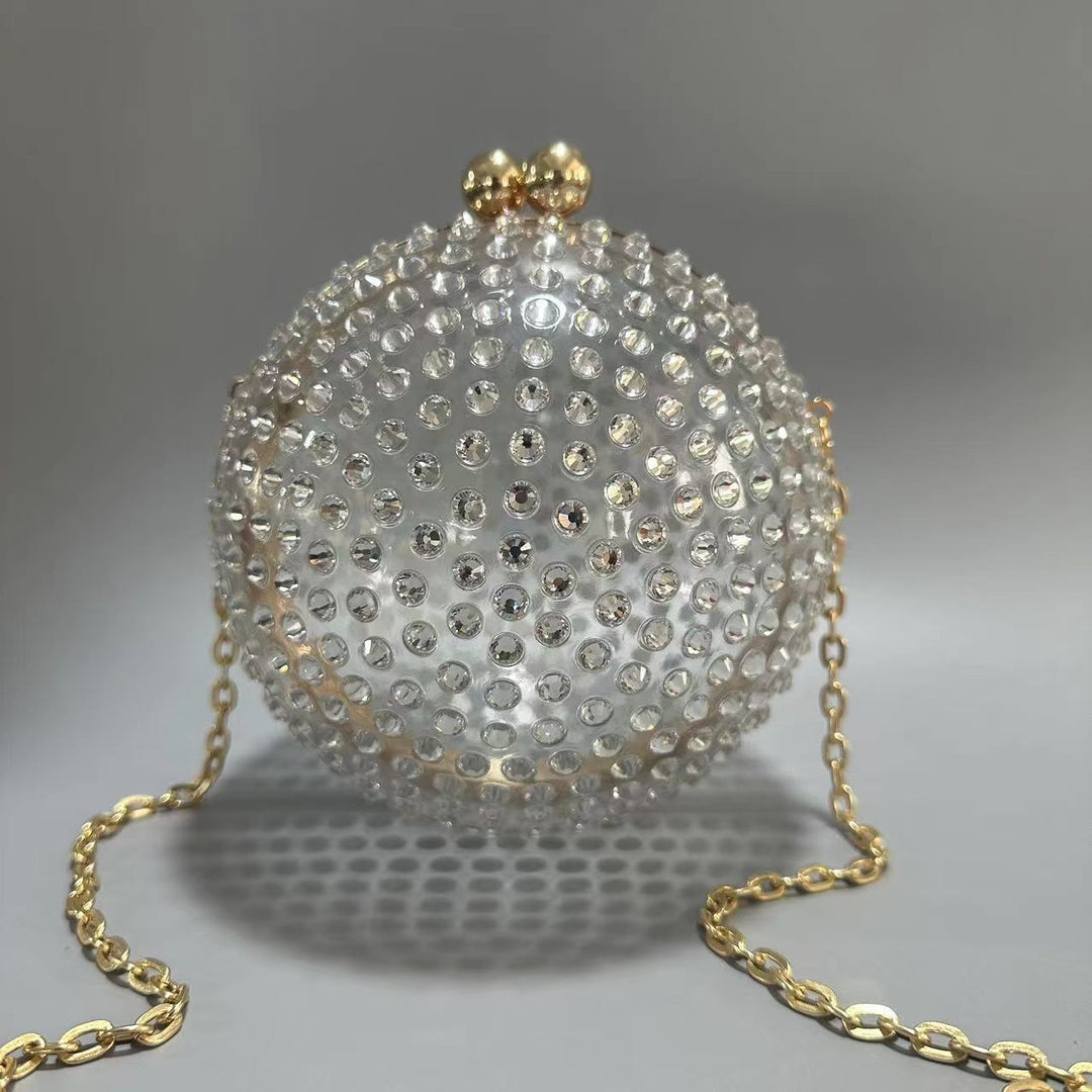 round crystal-embellished clutch with gold frame – NORVILA