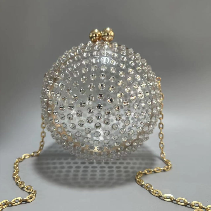 round crystal-embellished clutch with gold frame – NORVILA