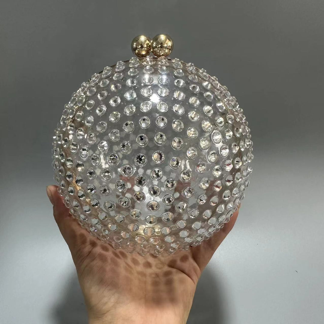 round crystal-embellished clutch with gold frame – NORVILA