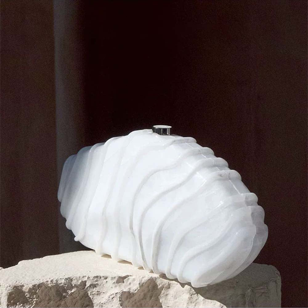 sculpted marble-effect clutch with wave texture – CORALVU