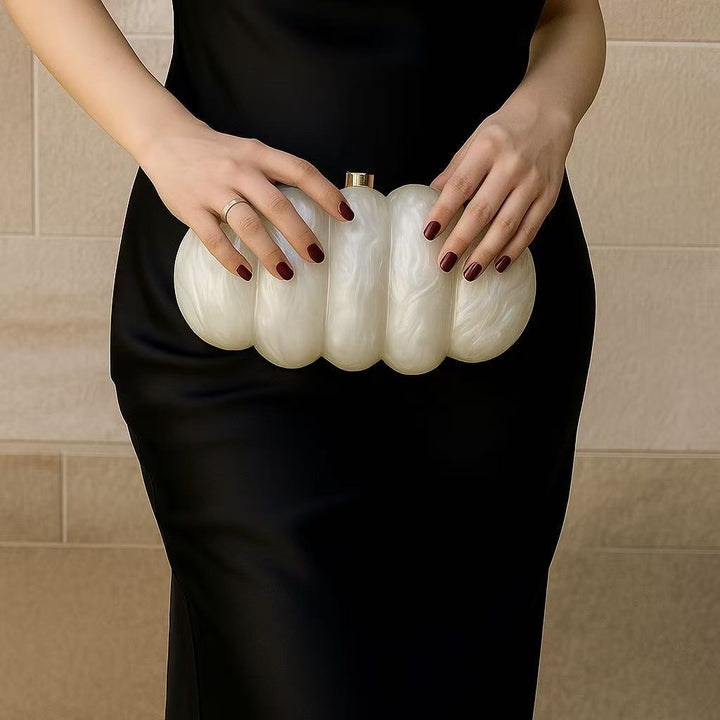 sculpted fuchsia resin clutch with glossy finish – RUBINA