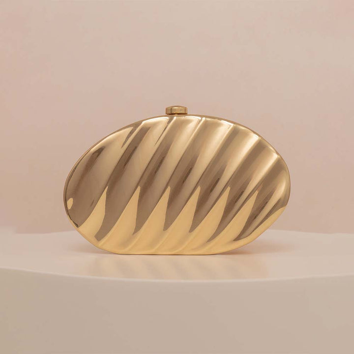 Textured metallic clutch with sculpted wave design – SHELL