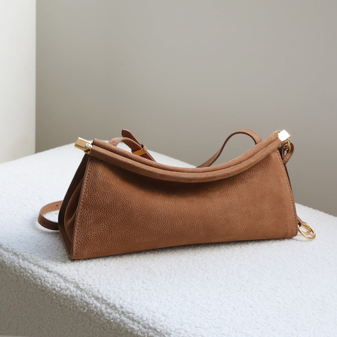 sleek leather shoulder bag with curved silhouette – ZOKSH