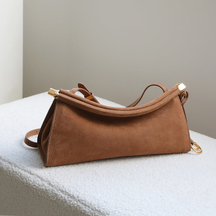 sleek leather shoulder bag with curved silhouette – ZOKSH