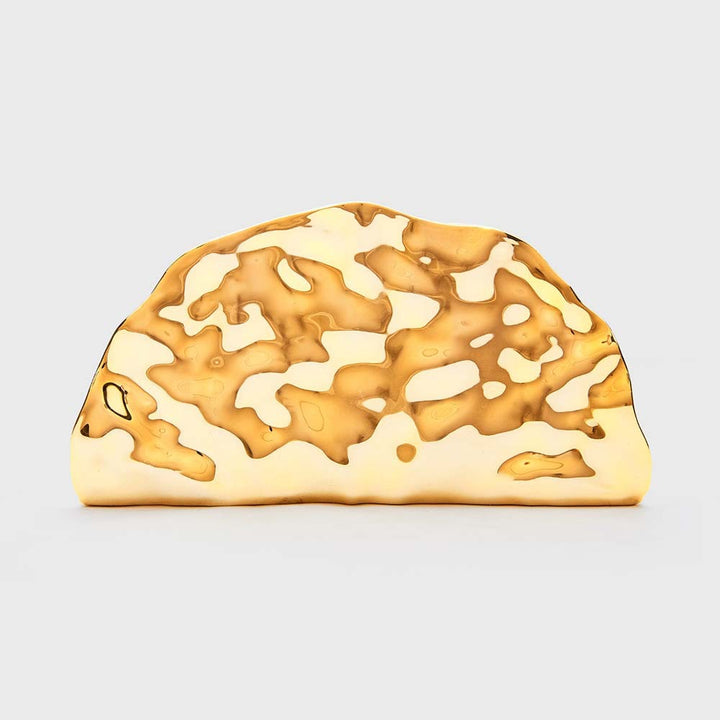 sculpted metallic clutch with abstract cutout design – NOIRÉP