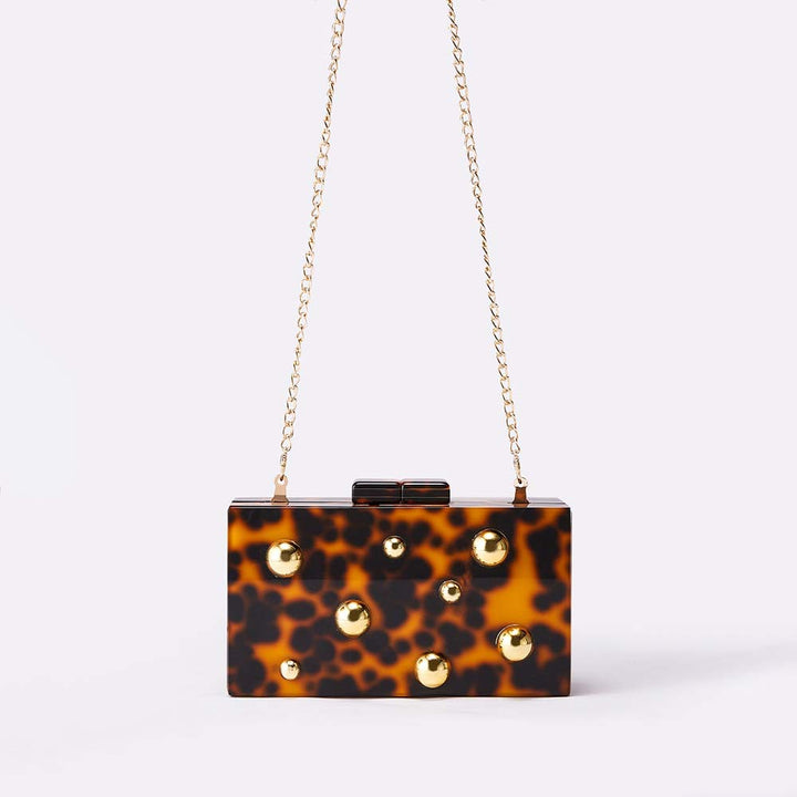 Tortoiseshell box clutch with gold stud accents – BASMA