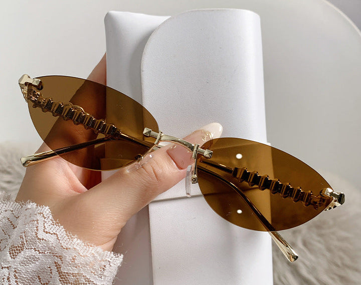 rimless cat-eye sunglasses with gold studded temples – ASTRIDI